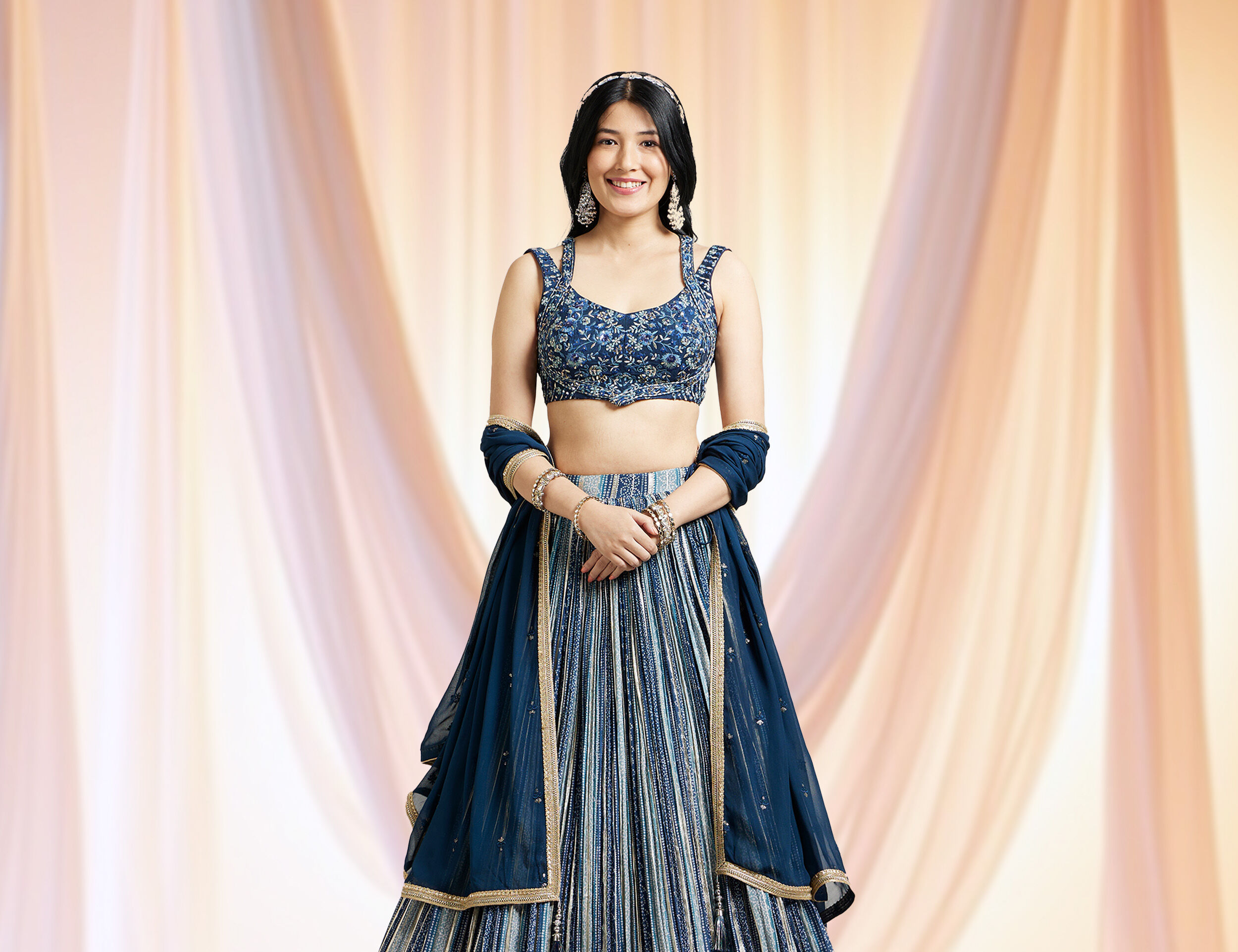 Bride in an elegant blue dupatta paired with a modern blue lehenga ensemble